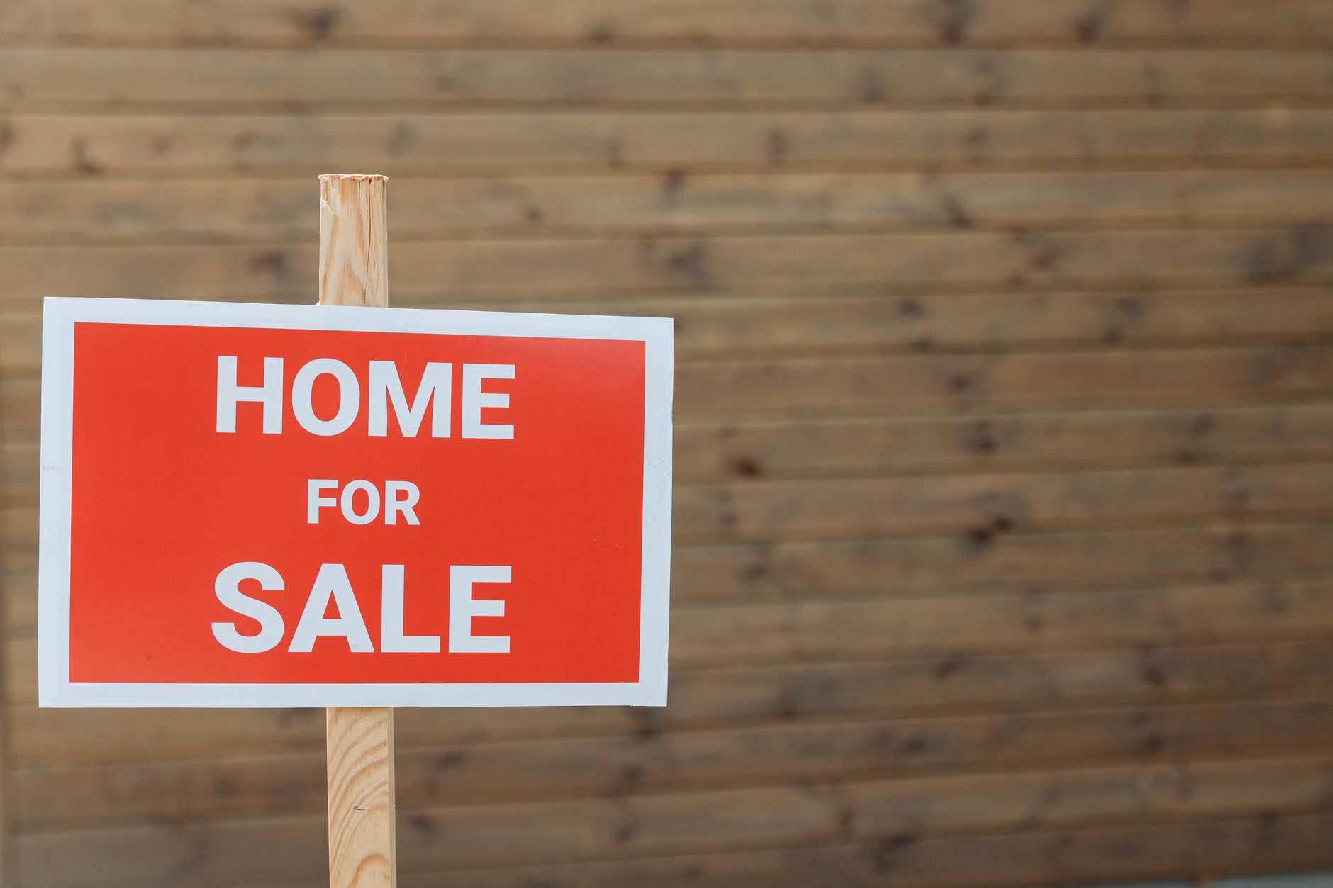 Family home with For Sale sign, highlighting key steps for selling residential property efficiently